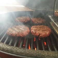 Cooking burgers on a cast iron searing grate | Friendly Fires